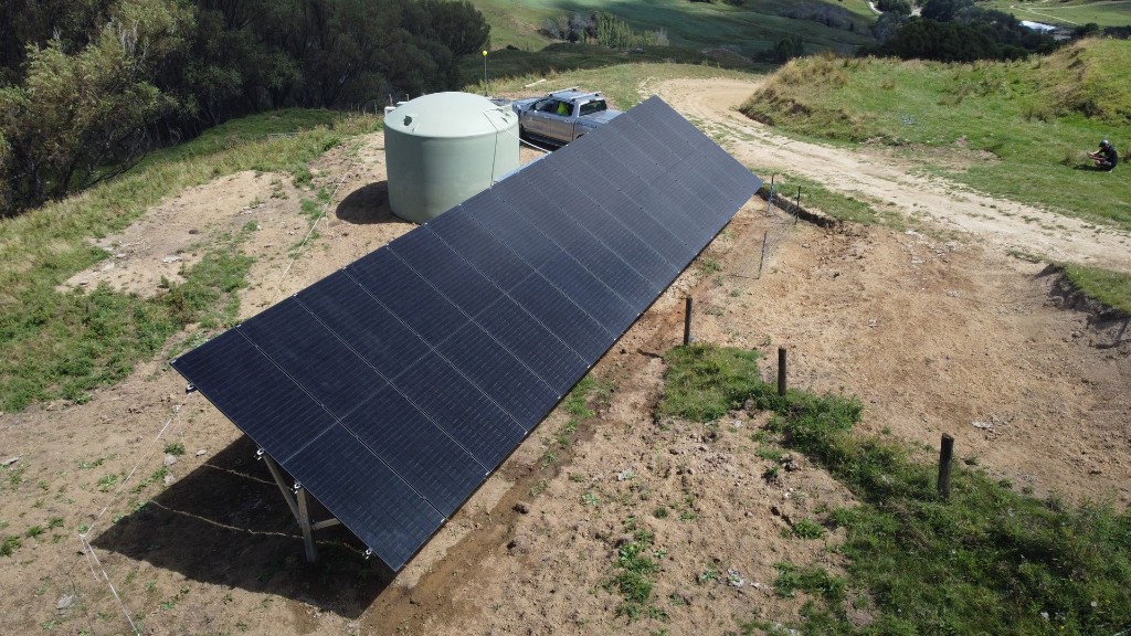 Off-grid solar pump array installation in rural terrain