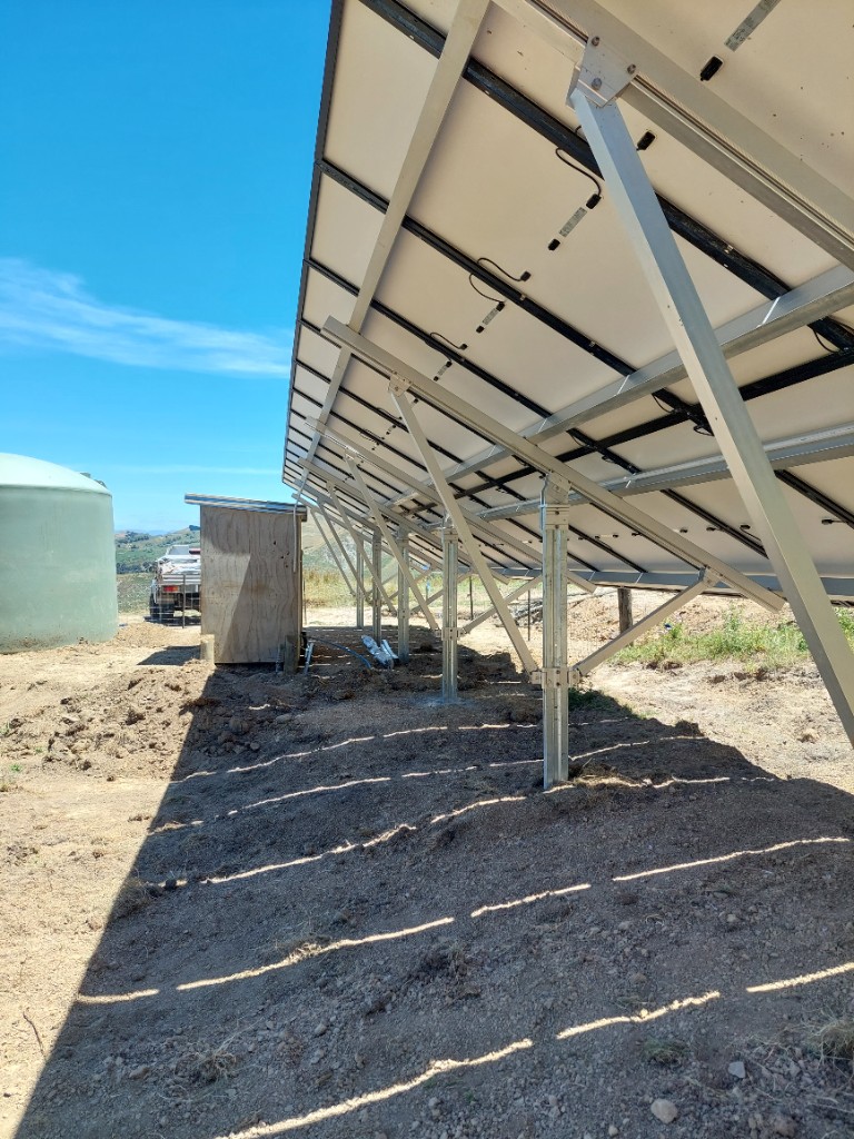 Ground mount underside and cable routing for solar pump array