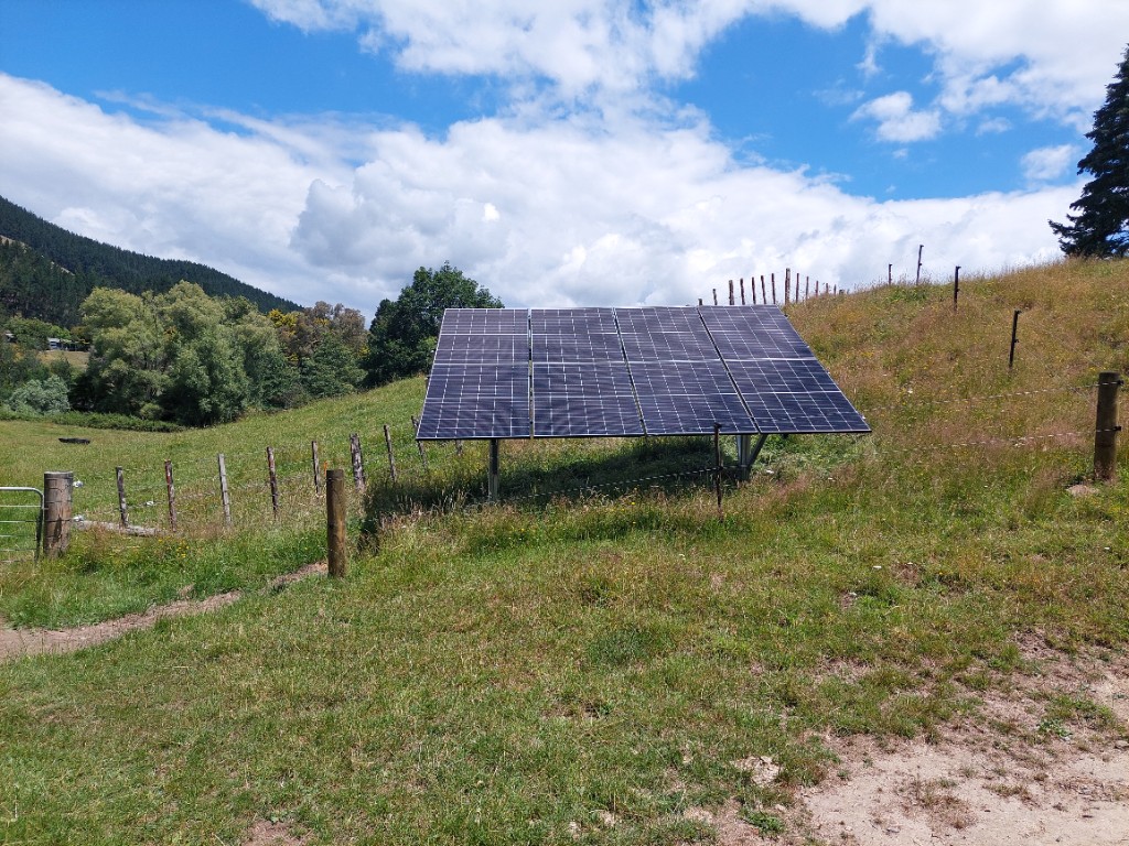 Off-grid ground-mounted solar array on rural hillside