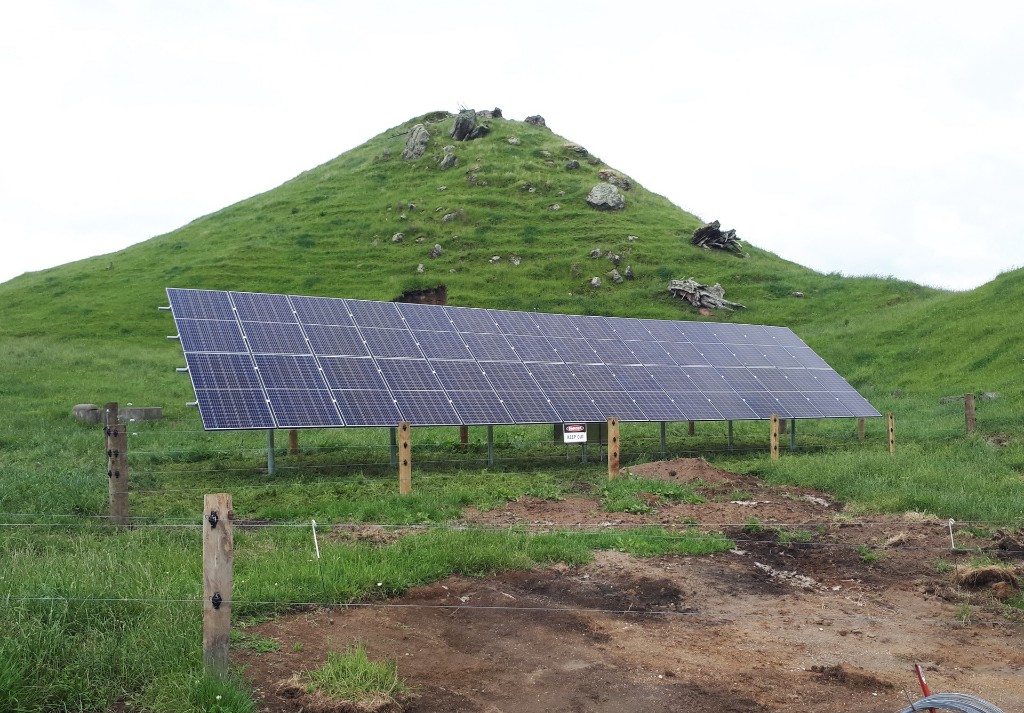 Solar pump array installation near hillside home